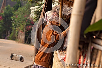 Akha vendor prepares her booth