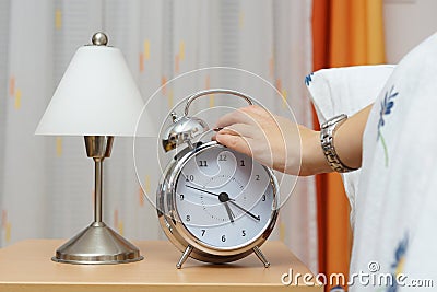 Alarm clock with woman in bed