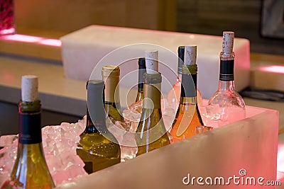 Alcohol drinks bottles in ice in bar restaurant