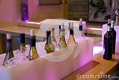Alcohol drinks bottles in ice in bar restaurant