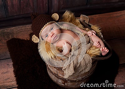 Alert Newborn Baby Boy Wearing a Monkey Hat