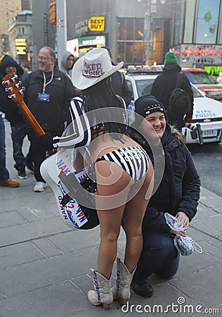 Alex, the Naked Cowgirl, entertains the crowd in Times Square during Super Bowl XLVIII week in Manhattan