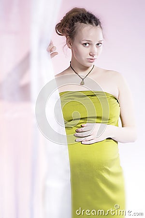 Amazing beauty pregnant woman behind curtain