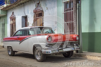 American classic car in front of a colonial house in Trinidad, Cuba