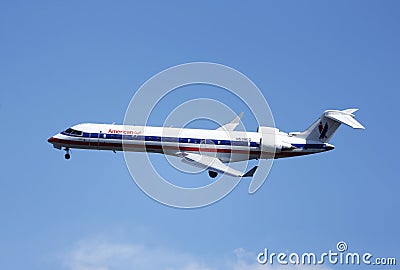 American Eagle Bombardier CRJ-700 plane in New York sky before landing ...