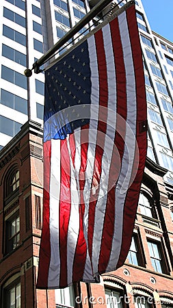 American flag and buildings