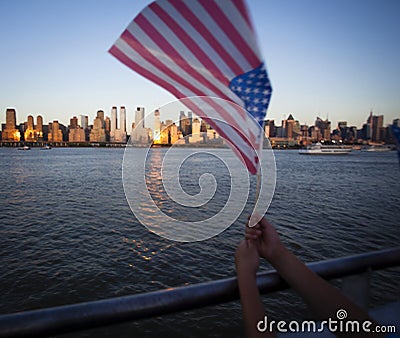 American flag during Independence Day on the Hudson River with a view at Manhattan - New York City - United States