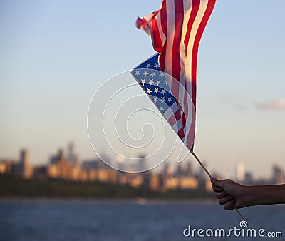 American flag during Independence Day on the Hudson River with a view at Manhattan - New York City - United States