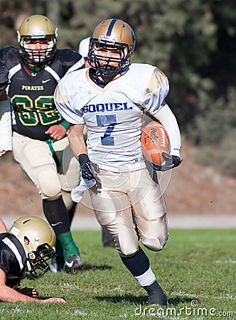 American Football Player Running with the Ball During a Game