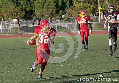 American Football Player Running with the Ball