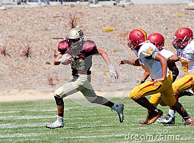 American Football Player Running with the Ball