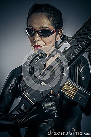 American, Sexy girl military woman posing with guns.