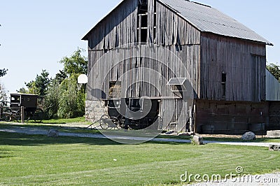 Amish buggy and old barn in the country