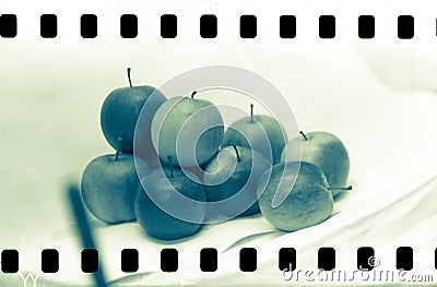 Analogue film frame with apples