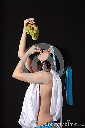 Ancient greece woman with a bunch of grapes