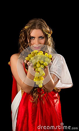 Ancient greece woman hands a bunch of grapes