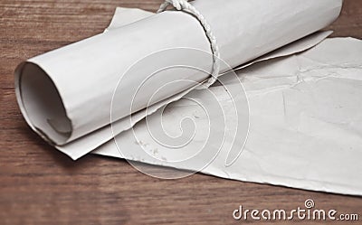 Ancient scroll with paper on wood table