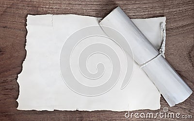 Ancient scroll with paper on wood table