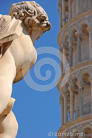 An angel of La Fontana dei Putti with slight view of Leaning Tower of Pisa