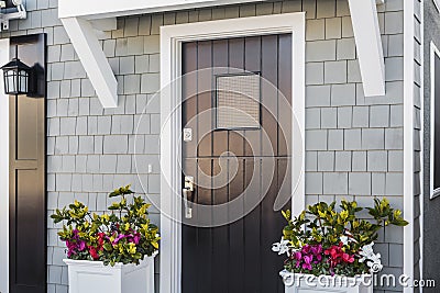 Angled view of black front door to home