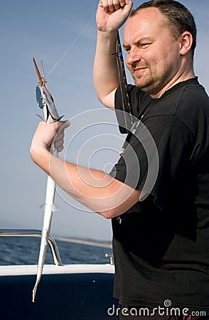 Angler catching fish