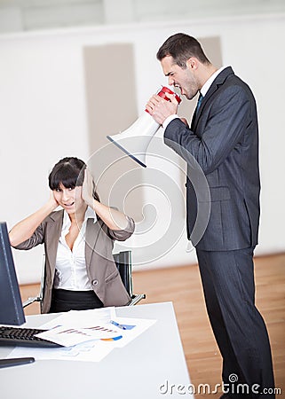 Angry boss screaming at employee