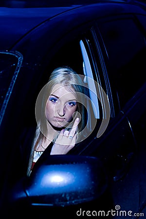 Angry female driver gesturing