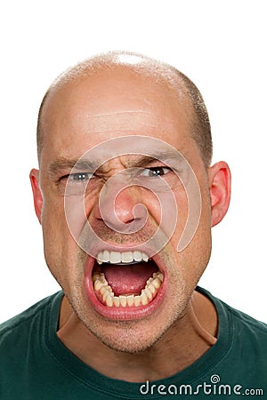 Angry and mad man screams with his mouth wide open showing his rage. Angry and mad man screams with his mouth wide open showing his rage.