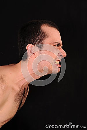 Angry man on black background