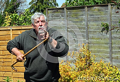 Angry man with a walking stick.