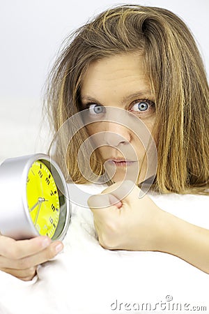 Angry woman ready to punch alarm clock