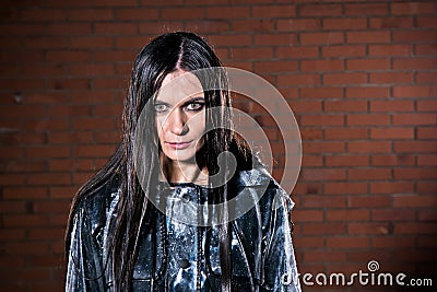 Angry woman with wet hair after the rain