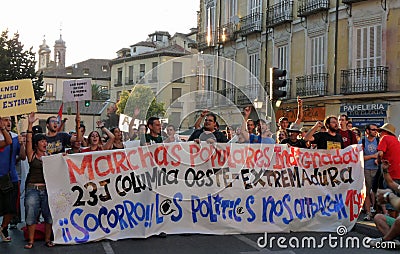 Anti-government demonstration with big banner on streets of Madrid, Spain
