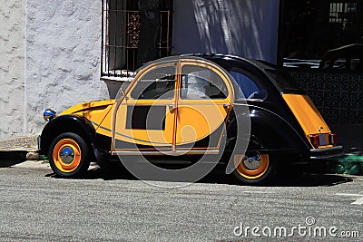 Antique Black Orange Beatle Car