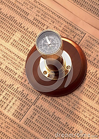 Antique compass on stock index