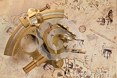 Antique sextant on old map