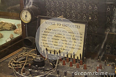Antique telephone switch with sign