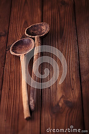 Antique vintage wooden spoon on old wood