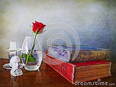 Antiques books, single red rose and other paraphernalia