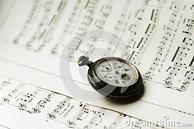 Antque Pocket Watch On Music Sheets