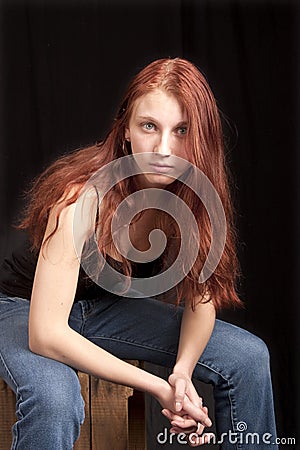 anxious-teen-redhead-seated-12732274.jpg