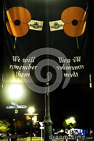 ANZAC Day remembrance flags under street lighting