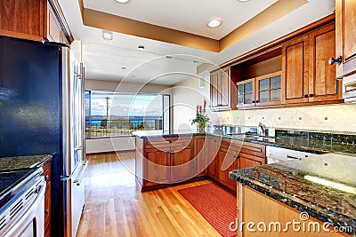 Apartment kitchen with water view and granite.