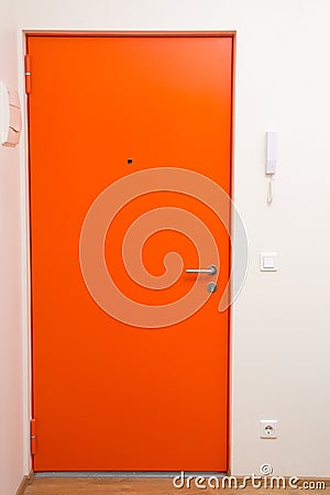 Apartment orange door over white wall