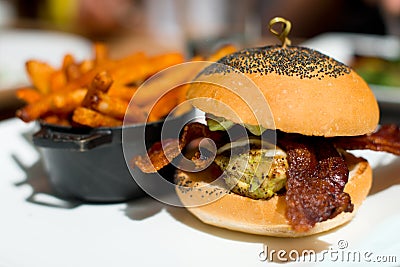 Appetizing meat and bacon roll with poppy seeds