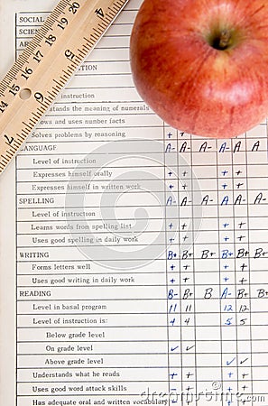 Apple and ruler on a vintage report card