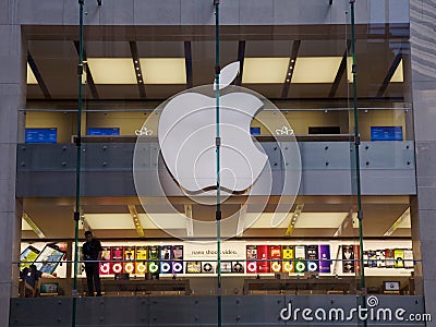 Apple store, people shopping for computers