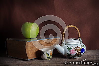 Apple and tea kit with book.