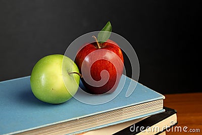 Apples on stack of books