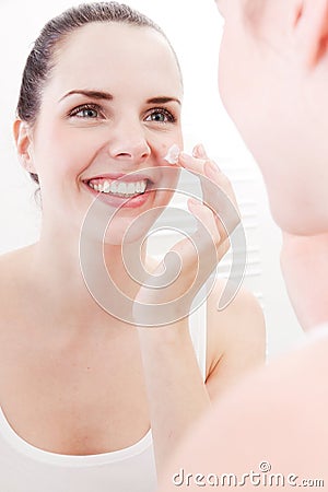 Applying cream on face skincare
